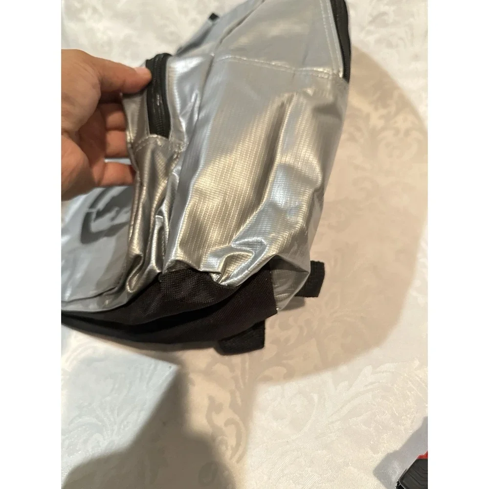 Ecko by Marc Ecko silver metallic backpack iconic black rhino logo front pocket